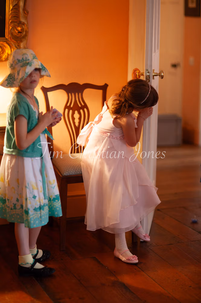 Bridesmaid and her friend captured naturally