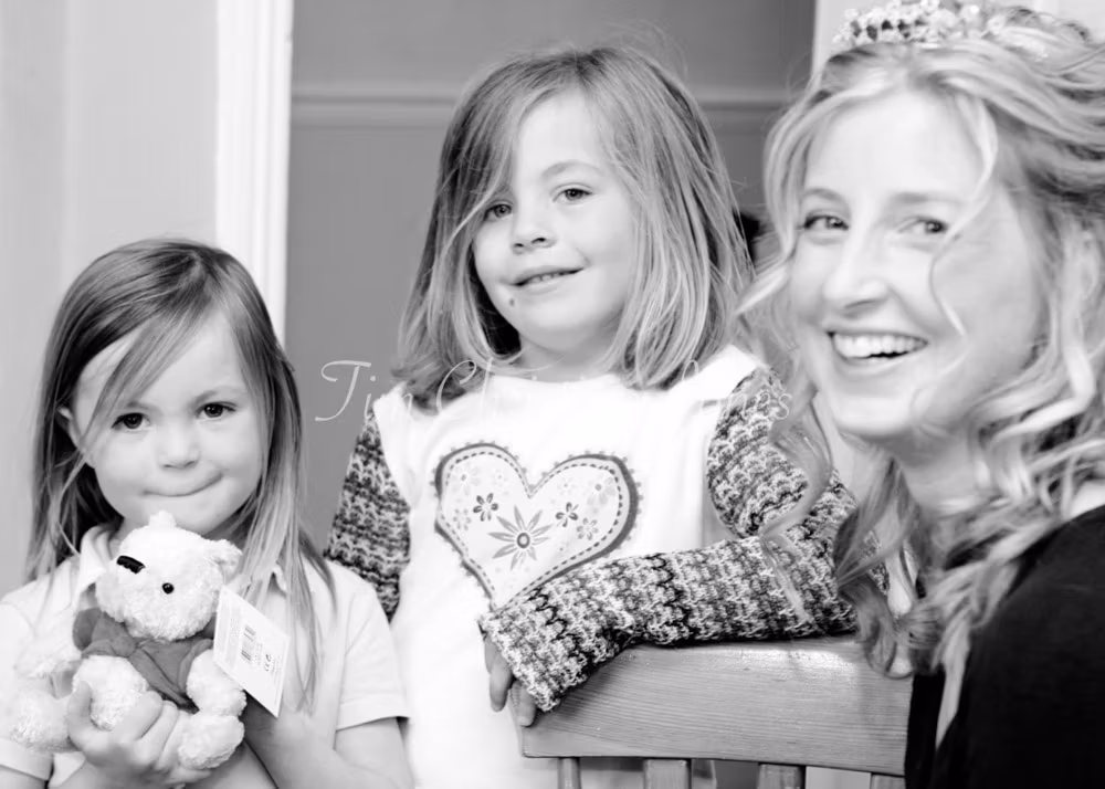 Bride with her 2 daughters in the morning of the wedding
