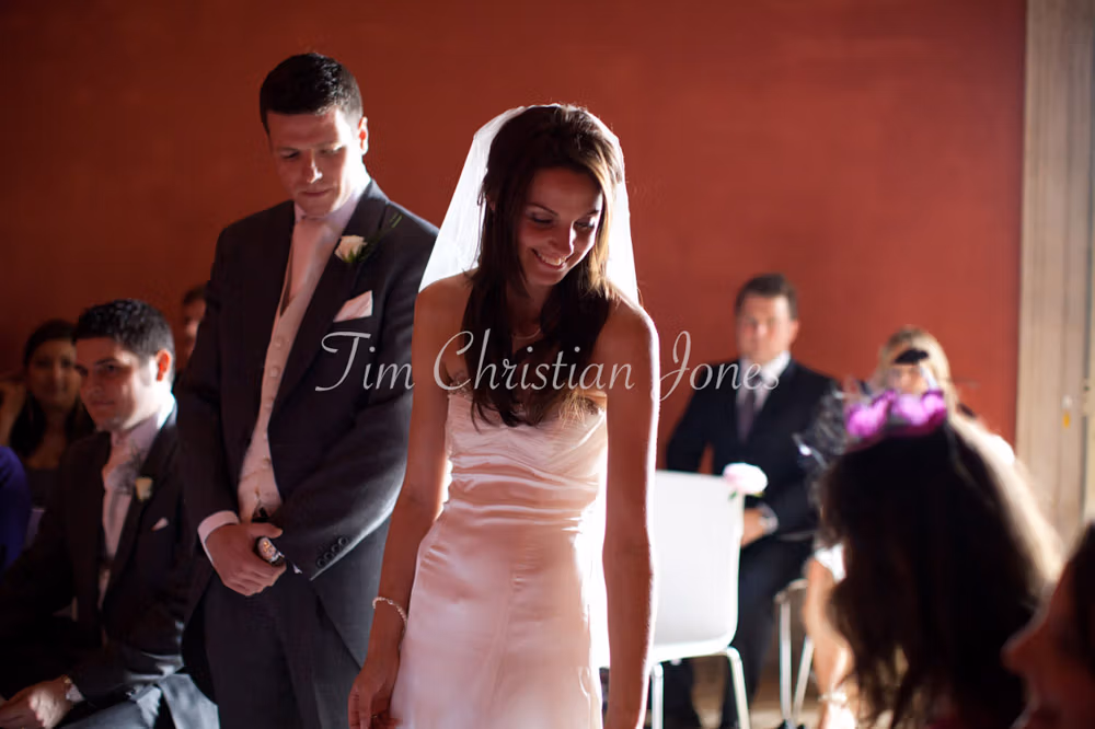 The bride’s bouquet is gently passed to her mum at the start of the ceremony