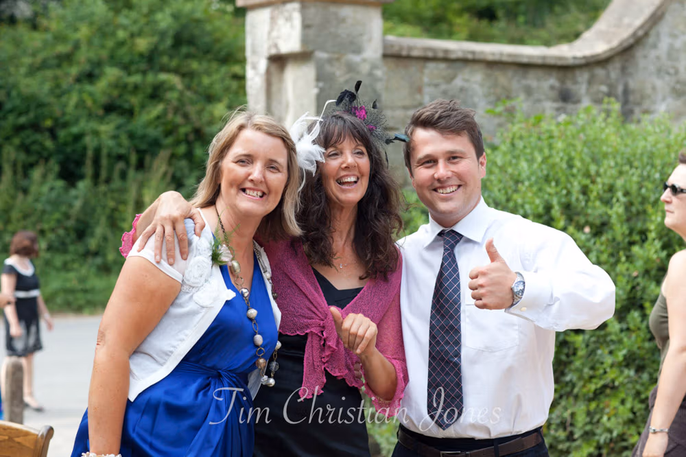 The same three giving a playful thumbs up to the camera