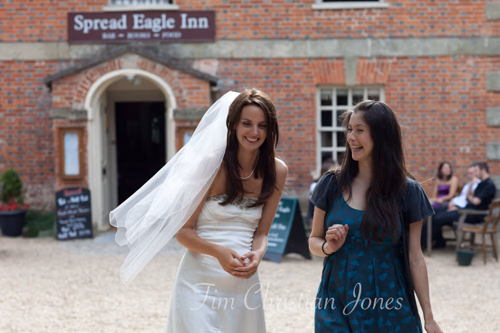 Lowri and a close friend laughing together outdoors